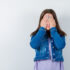 young-woman-keeping-hands-eyes-t-shirt-jacket-looking-scared-front-view_176474-108233